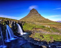 Kirkjufell Mountain and Kirkjufellsfoss The famous Kirkjufell-Mountain and Kirkjufellsfoss in Iceland.