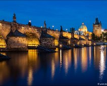 Charles Bridge and Old Town Bridge Tower in Prague The historical Charles Bridge and the Old Town Bridge Tower of Prague at dawn. The River Moldau is in front. You can also see the St. Francis Of Assisi Church..