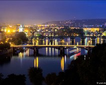 Moldau Bridges in Prague A view at late dawn after a rainy day over the river Moldau in Prague, and the bridges over the Moldau. You can see Mánes Bridge, Charles Bridge, Legion Bridge...